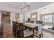 Bright dining room features a large table, chandelier, and hardwood floors at 1684 E Coconino Dr, Chandler, AZ 85249