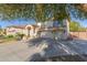 Two-story house with solar panels, double garage, and driveway at 1684 E Coconino Dr, Chandler, AZ 85249