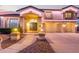 Elegant two-story home with a three-car garage, covered entry, and decorative lighting at 1684 E Coconino Dr, Chandler, AZ 85249