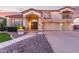 Charming home with well-maintained landscaping, a three-car garage, and a welcoming entryway at 1684 E Coconino Dr, Chandler, AZ 85249