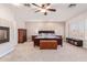 Main bedroom with fireplace, built-in shelving, and ceiling fan at 1684 E Coconino Dr, Chandler, AZ 85249