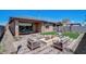 Landscaped backyard with firepit and patio furniture at 19417 W Badgett Ln, Litchfield Park, AZ 85340