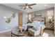 Main bedroom with a king-size bed and ensuite bathroom at 19417 W Badgett Ln, Litchfield Park, AZ 85340