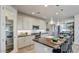 Modern kitchen with stainless steel appliances and an island at 19417 W Badgett Ln, Litchfield Park, AZ 85340