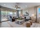 Living room with sliding glass doors leading to backyard at 19417 W Badgett Ln, Litchfield Park, AZ 85340