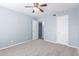 Bedroom featuring carpet flooring, neutral paint and baseboards, and white doors at 200 E Southern Ave # 118, Tempe, AZ 85282