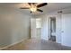 Spacious bedroom with ceiling fan and private bathroom access at 200 E Southern Ave # 118, Tempe, AZ 85282