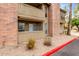 Apartment building exterior featuring wood railings and rock landscaping at 200 E Southern Ave # 118, Tempe, AZ 85282