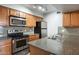 Modern kitchen with granite countertops and stainless steel appliances at 200 E Southern Ave # 118, Tempe, AZ 85282