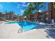 Refreshing community swimming pool with lounge chairs at 200 E Southern Ave # 118, Tempe, AZ 85282