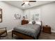 Guest bedroom with a gray comforter and ceiling fan at 20515 N 274Th Ln, Buckeye, AZ 85396