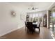 Bright dining room with a wood table and six chairs at 20515 N 274Th Ln, Buckeye, AZ 85396