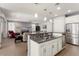 Modern kitchen with stainless steel appliances and an island at 20515 N 274Th Ln, Buckeye, AZ 85396