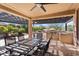 Outdoor kitchen and dining area under a pergola at 20515 N 274Th Ln, Buckeye, AZ 85396