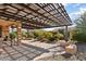 Spacious patio with pergola, seating, and desert landscaping at 20515 N 274Th Ln, Buckeye, AZ 85396