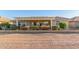 Home exterior showcasing a pergola and well-manicured landscaping at 2144 S Yellow Wood Ave, Mesa, AZ 85209