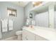 Clean bathroom with white vanity, shower/tub combo, and decorative accents at 2144 S Yellow Wood Ave, Mesa, AZ 85209