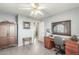 Home office with a desk, chair and built in wooden cabinet at 2144 S Yellow Wood Ave, Mesa, AZ 85209