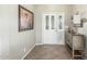 Bright entryway with tile flooring, a wooden console table, and a framed painting at 2144 S Yellow Wood Ave, Mesa, AZ 85209