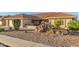 Single-story home with a tile roof, neutral exterior, and desert landscaping at 2144 S Yellow Wood Ave, Mesa, AZ 85209