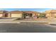 Front view of a single-story house with a tan exterior and tile roof at 2144 S Yellow Wood Ave, Mesa, AZ 85209