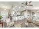 Open living room and kitchen with a center island and neutral color scheme at 2144 S Yellow Wood Ave, Mesa, AZ 85209