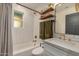 Clean bathroom with white subway tiles, updated vanity, and gold fixtures at 2218 N 8Th St, Phoenix, AZ 85006