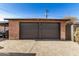 Double-car garage with dark brown doors at 2218 N 8Th St, Phoenix, AZ 85006