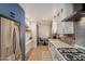 Modern kitchen with white cabinets and gas stove at 2218 N 8Th St, Phoenix, AZ 85006