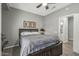 Guest bedroom with ensuite bathroom access and ceiling fan at 22205 N Cochise Ln, Sun City West, AZ 85375