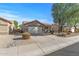 House exterior with driveway and landscaping at 22205 N Cochise Ln, Sun City West, AZ 85375