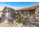 Front entry and walkway of a one-story home with a neutral color palette at 22205 N Cochise Ln, Sun City West, AZ 85375