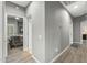 Bright hallway with light gray walls and wood-look flooring at 22205 N Cochise Ln, Sun City West, AZ 85375