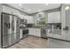 Kitchen with stainless steel appliances and granite countertops at 22205 N Cochise Ln, Sun City West, AZ 85375