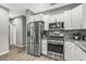 Modern kitchen featuring stainless steel appliances and granite counters at 22205 N Cochise Ln, Sun City West, AZ 85375