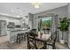 Modern kitchen with white cabinets, granite counters, and stainless steel appliances at 22205 N Cochise Ln, Sun City West, AZ 85375