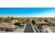 Aerial view of a residential street lined with houses at 22331 N 80Th Ave, Peoria, AZ 85383