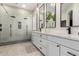 Modern bathroom with double vanity, large shower, and elegant tile at 22331 N 80Th Ave, Peoria, AZ 85383