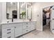 Modern bathroom with double vanity, quartz countertops, and walk-in closet at 22331 N 80Th Ave, Peoria, AZ 85383