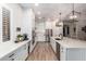 Bright kitchen with white cabinets, an expansive island, and stainless steel appliances at 22331 N 80Th Ave, Peoria, AZ 85383