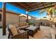 Covered patio with comfortable seating and a view of the backyard at 22331 N 80Th Ave, Peoria, AZ 85383