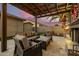 Covered patio with seating area and beautiful sunset views at 22331 N 80Th Ave, Peoria, AZ 85383