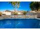 Relaxing pool with a stone waterfall feature and plenty of lounge space at 22331 N 80Th Ave, Peoria, AZ 85383