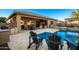 Inviting pool area with patio furniture and a built-in grill at 22331 N 80Th Ave, Peoria, AZ 85383