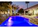 Luxury backyard oasis featuring a sparkling pool and spa, water features, and a covered patio at 22331 N 80Th Ave, Peoria, AZ 85383