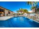 Inviting pool with waterfall features and a pergola-covered patio at 22331 N 80Th Ave, Peoria, AZ 85383