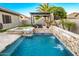 Resort-style backyard oasis with a sparkling pool and spa at 22331 N 80Th Ave, Peoria, AZ 85383