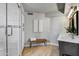 Modern bathroom with double vanities, a walk-in shower, and wood-look tile floors at 23575 N 75Th Pl, Scottsdale, AZ 85255