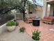 Relaxing patio with fire pit, seating, and tile flooring at 23575 N 75Th Pl, Scottsdale, AZ 85255