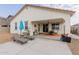 Covered patio, lounge chairs, and gravel landscaping at 2891 N Westridge Ln, Casa Grande, AZ 85122